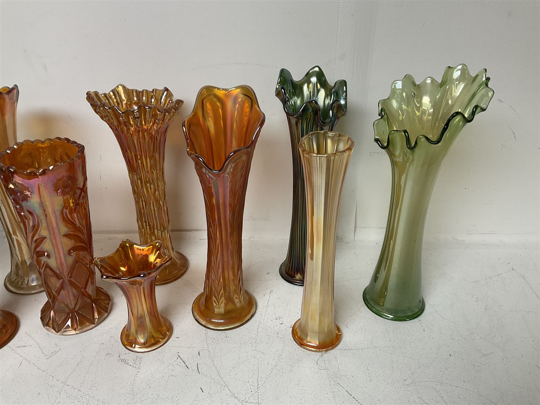 Collection of carnival glass trumpet vases and similar, largest H32cm