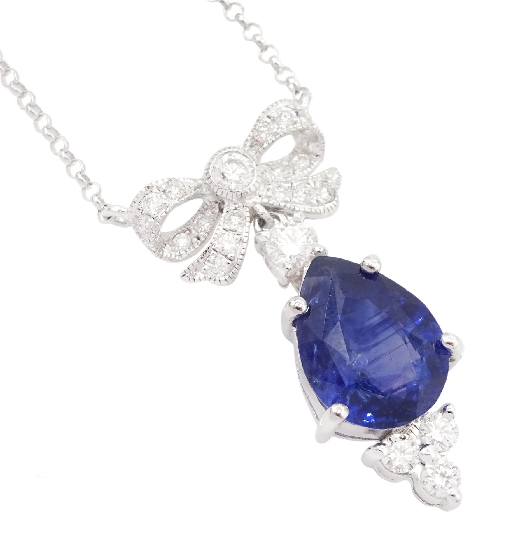 18ct white gold sapphire and diamond pendant necklace, the round brilliant cut diamond bow, suspending a pear cut sapphire and four round brilliant cut diamonds, stamped 750, sapphire approx 3.80 carat, total diamond weight approx 0.45 carat