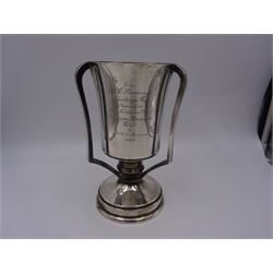 1930s silver three handled trophy, the tapering body inscribed with presentation engraving, upon stepped circular foot, hallmarked Grant & Son, Birmingham 1935, H22cm