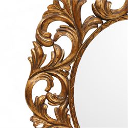 Florentine design gilt wall mirror, bevelled oval mirror plate surrounded by scrolling and interlaced acanthus leaves, curled leaf pediment 