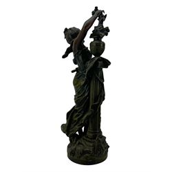 After L & F Moreau - Spelter table lamp in the form of a female figure next to a pedestal on circular naturalistic base H55cm