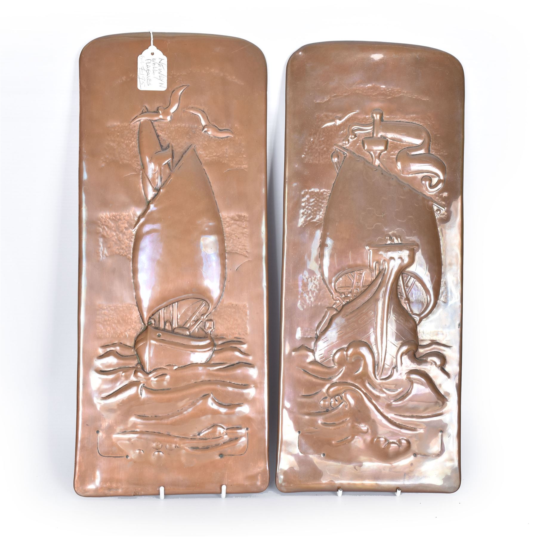 Two Newlyn Arts and Crafts copper wall plaques, each embossed with a ship, H43cm