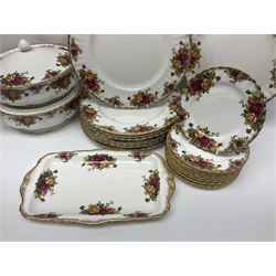 Royal Albert Old Country Roses pattern part tea and dinner service, to include two tureens, eight dinner plates, six side plates, twelve bowls, two mugs, seven teacups and saucers, milk jug,  twelve cake plates, six soup bowls and saucers, candlesticks, etc (95)