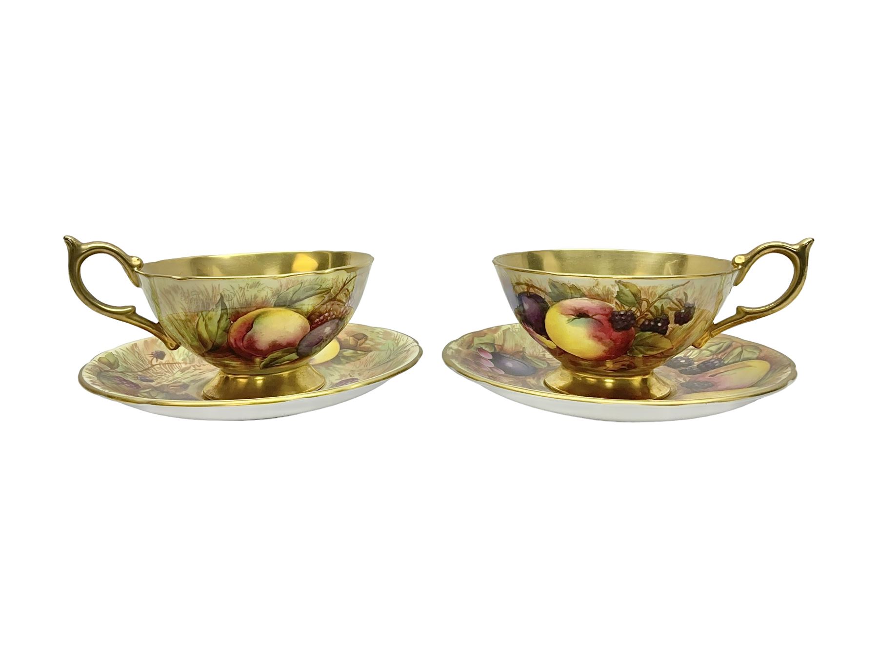 Pair Aynsley Orchard Gold pattern teacups and saucers with gilt interior 