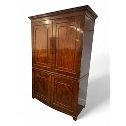 Victorian mahogany linen press, projecting cornice with dentil and scroll detailing, double panelled doors opening to an interior fitted with a brass hanging rail and coat hooks, lower section with two drawers and fitted shelves for additional storage, raised on bracket feet