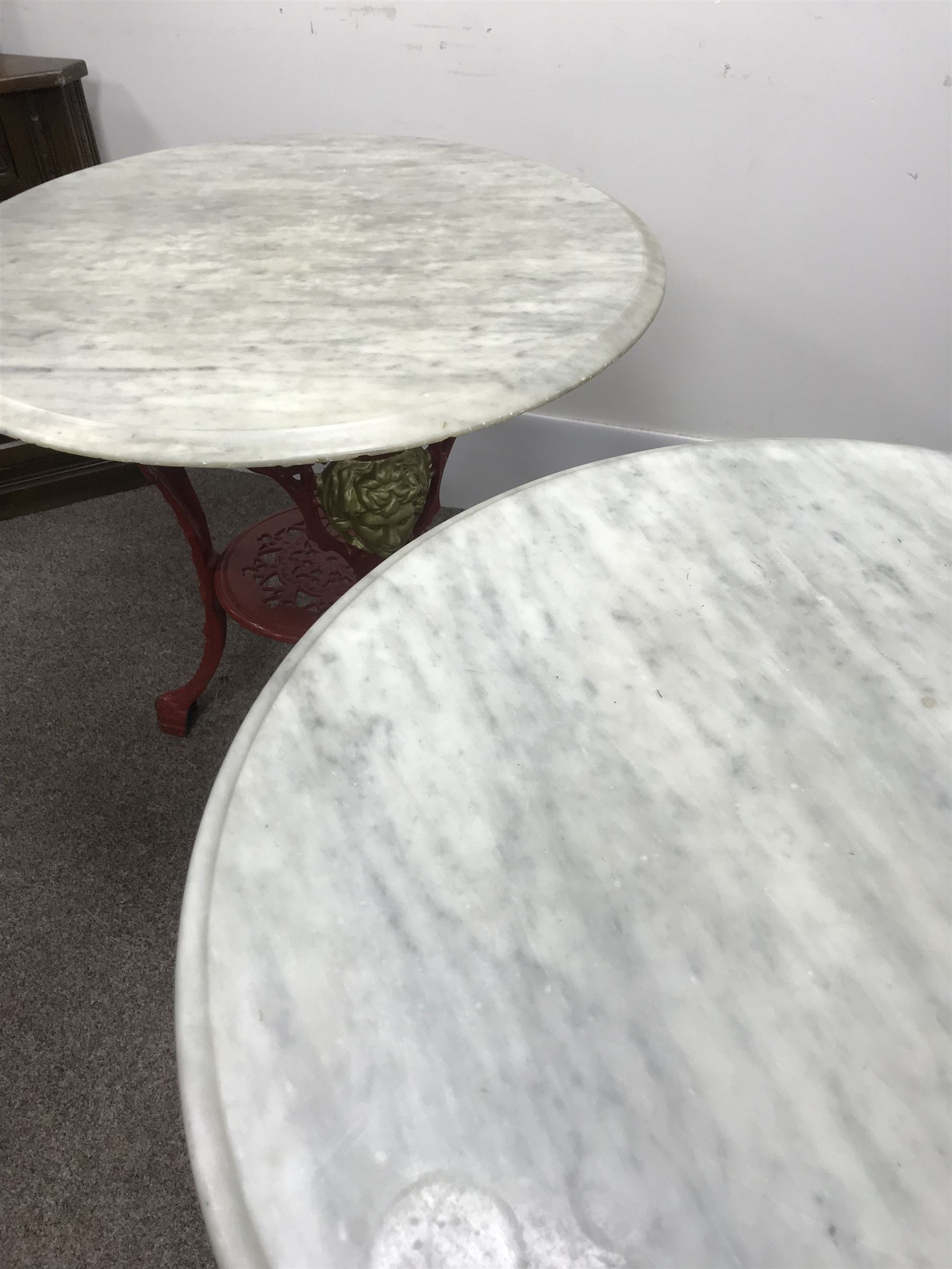 Pair cast iron Britannia pub tables, two red, small marble tops 