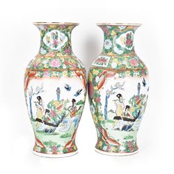 Pair of Famille Rose vases of baluster form, decorated with panels depicting musicians, H30cm