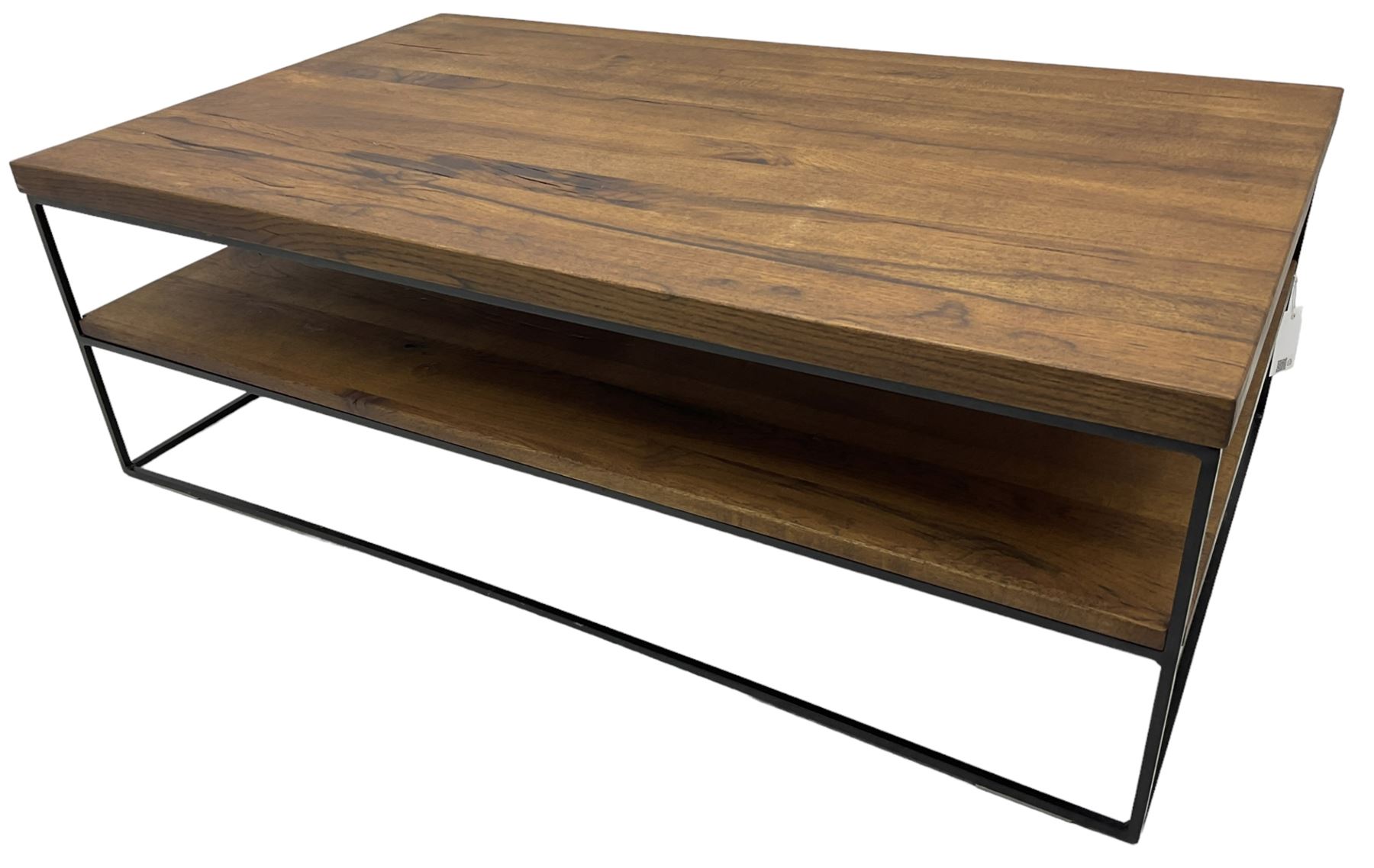 Samba oak coffee table, rectangular top over undertier storage, applied mid-tone finish, supported by black metal frame