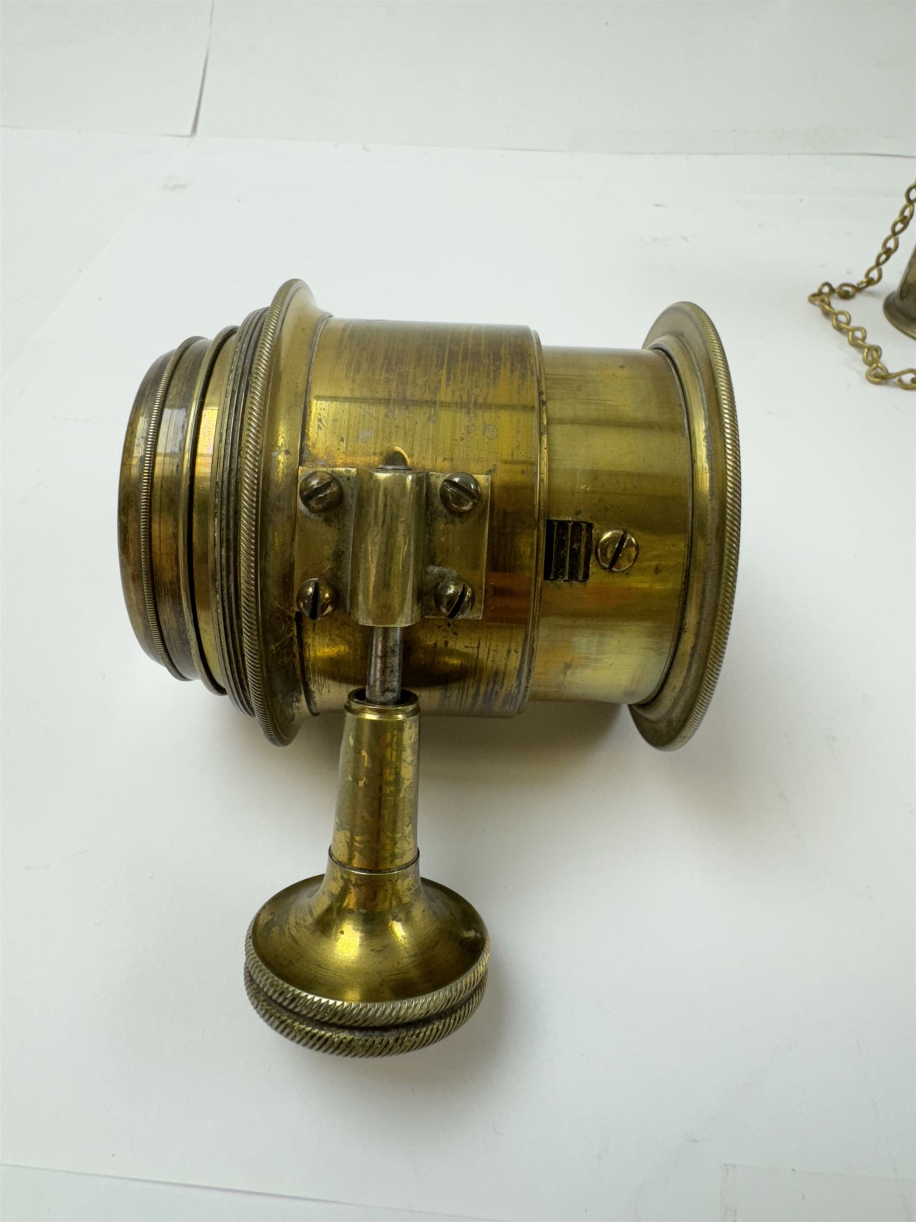 Late 19th century Watkins Exposure Meter, in cylindrical brass case, inscribed Sole Makers R. Field & Co, Birmingham, together with a 19th century brass plate camera lens