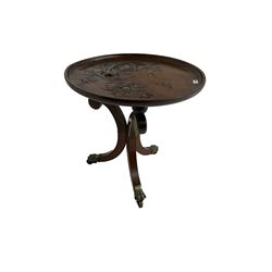 19th century occasional table, removable mahogany tray top carved and painted with tree and flower decoration, tripod rosewood base inlaid with mahogany and crossbanded, the supports scrolled with gilt chamfered edges and splayed, terminating in brass paw feet on castors