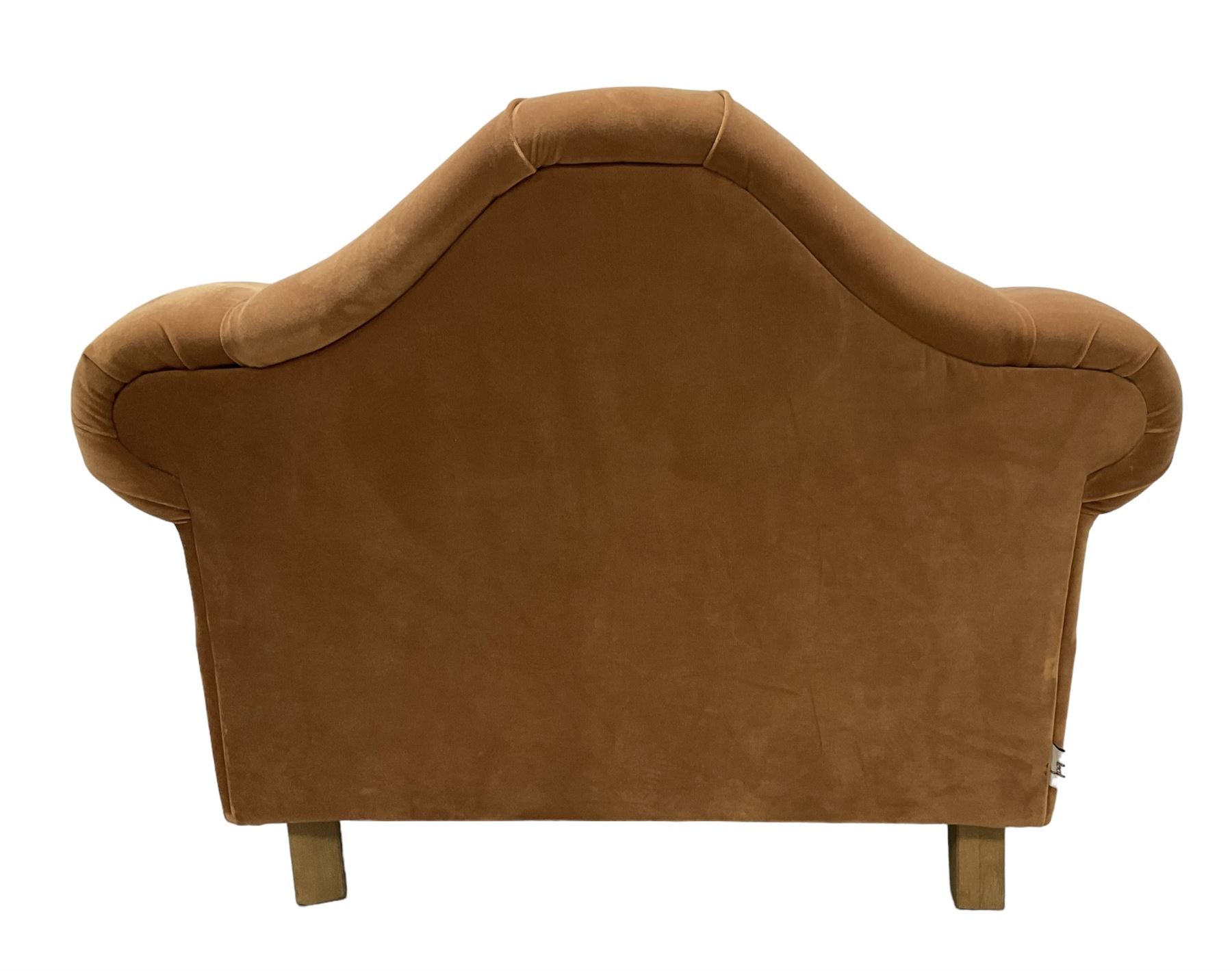 Loaf - hardwood-framed armchair, camelback and rolled arms, upholstered in rust velvet fabric, on turned oak front feet