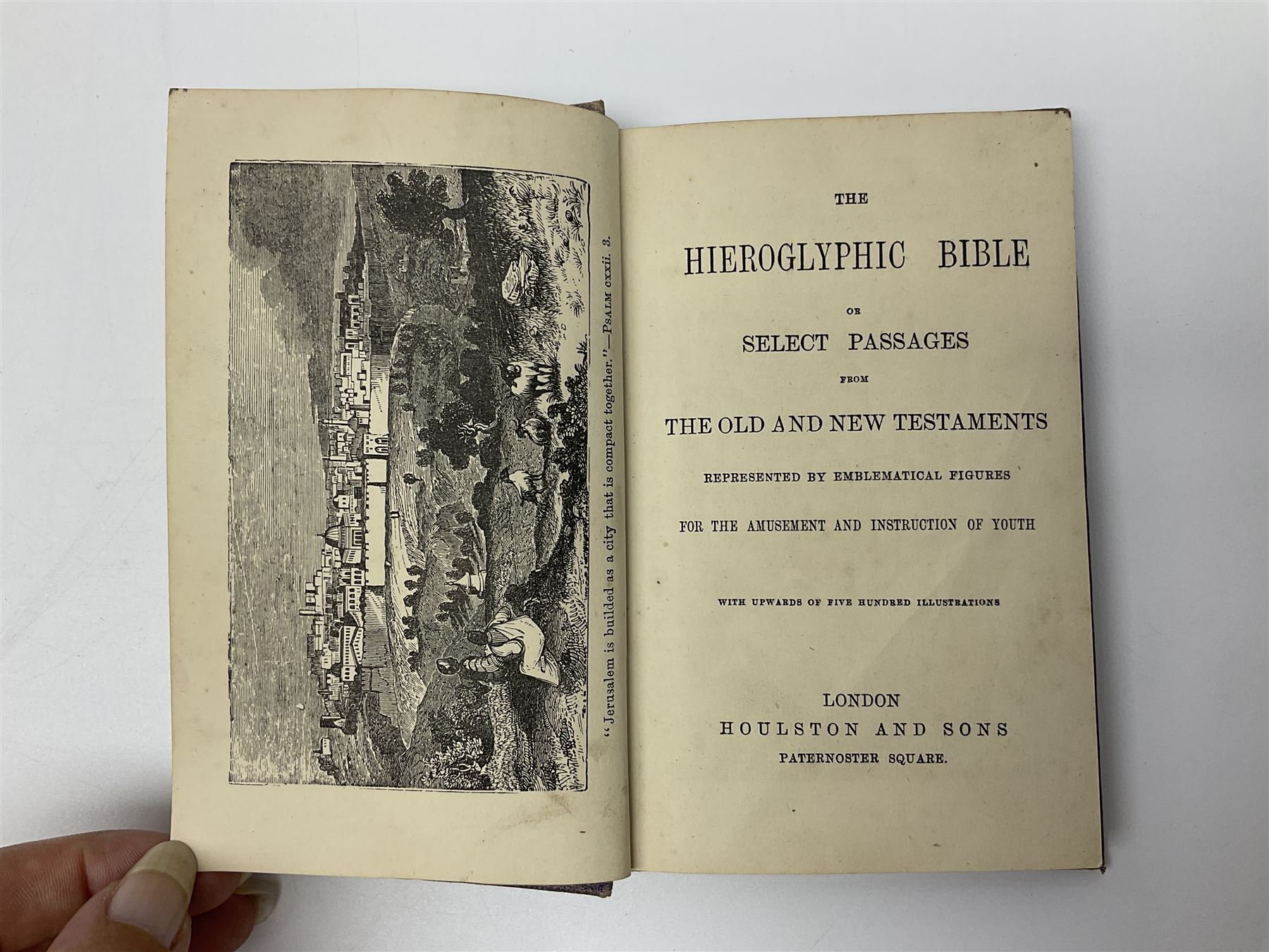 Early 20th century Hieroglyphic Bible or Select Passages from the Old and New Testament Represented by Emblematical Figures For The Amusement and Instruction of Youth, pub. Houlston and Sons, London, together with a wooden crucifix with metal banding and details, including skull and crossbones motif, and one other crucifix