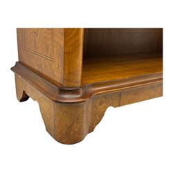 Figured walnut open bookcase, moulded top over two drawers and two shelves, on plinth base 