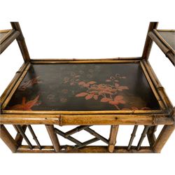 Late 19th century Aesthetic Movement lacquered and painted bamboo occasional table, rectangular top painted with Japanned traditional bird and blossom scenes, over two fold-out side leaves and undertier with pierced gallery apron