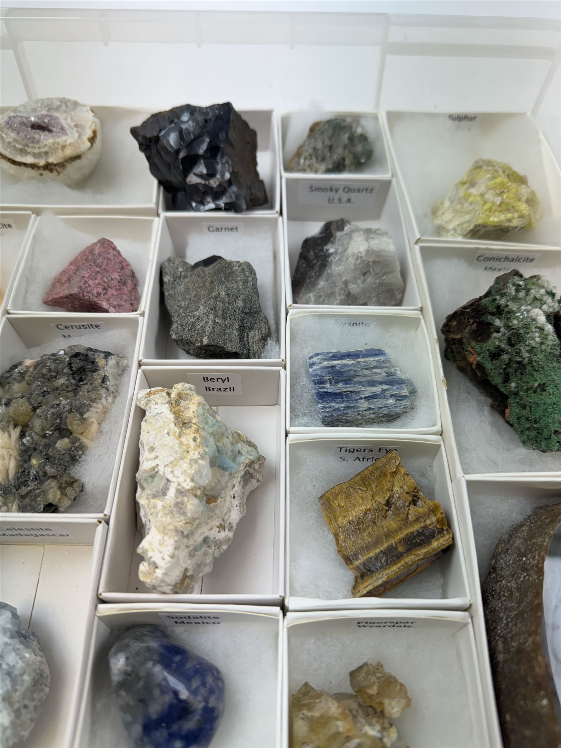 Collection of twenty-three mineral specimens, including orange calcite, realgar, conichalcite etc 
