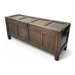 17th century panelled oak blanket chest or kist, quadruple panelled hinged lid over quadruple panelled front, moulded frame and pegged construction, on stile supports