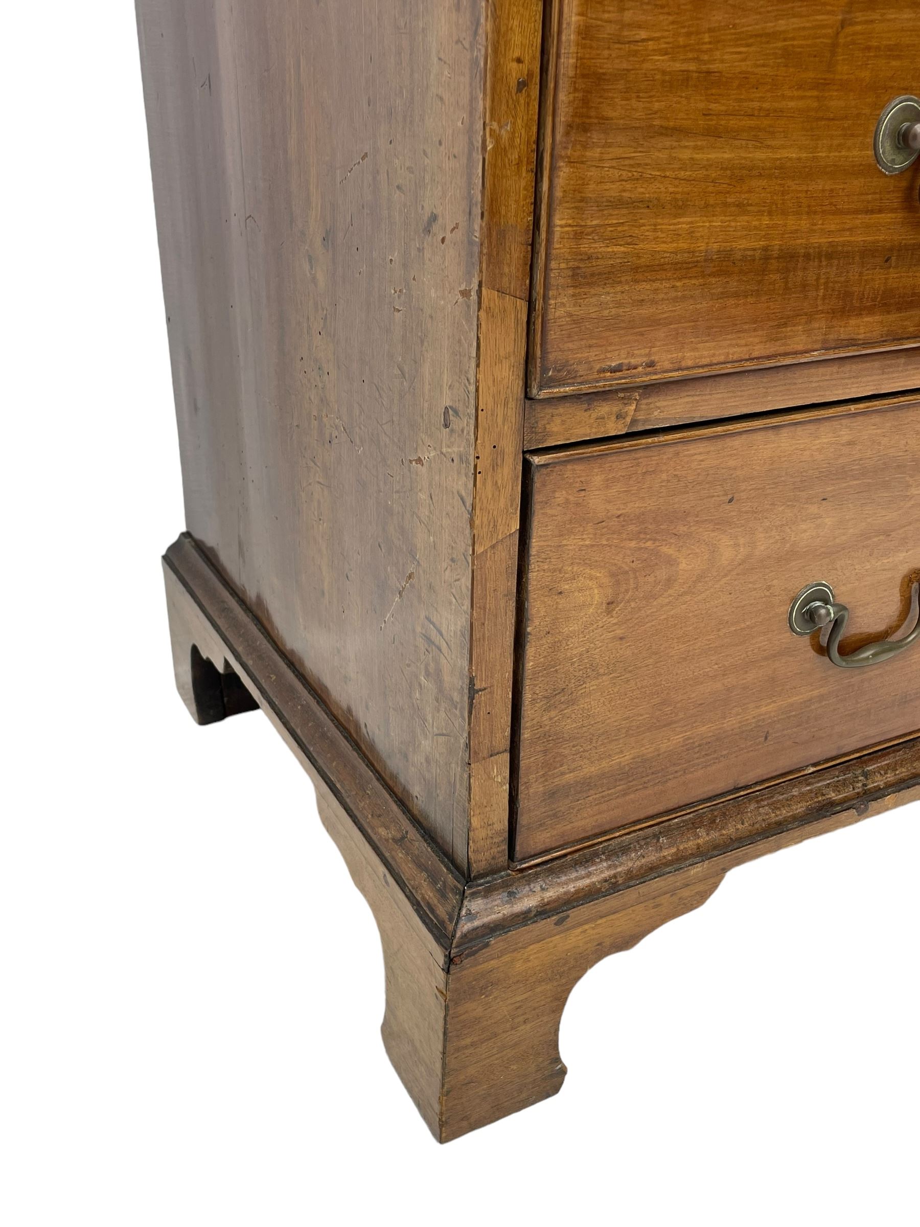 George III mahogany chest, moulded rectangular top over two short and three long cock-beaded drawers, fitted with brass swan neck handles and circular plates, on bracket feet