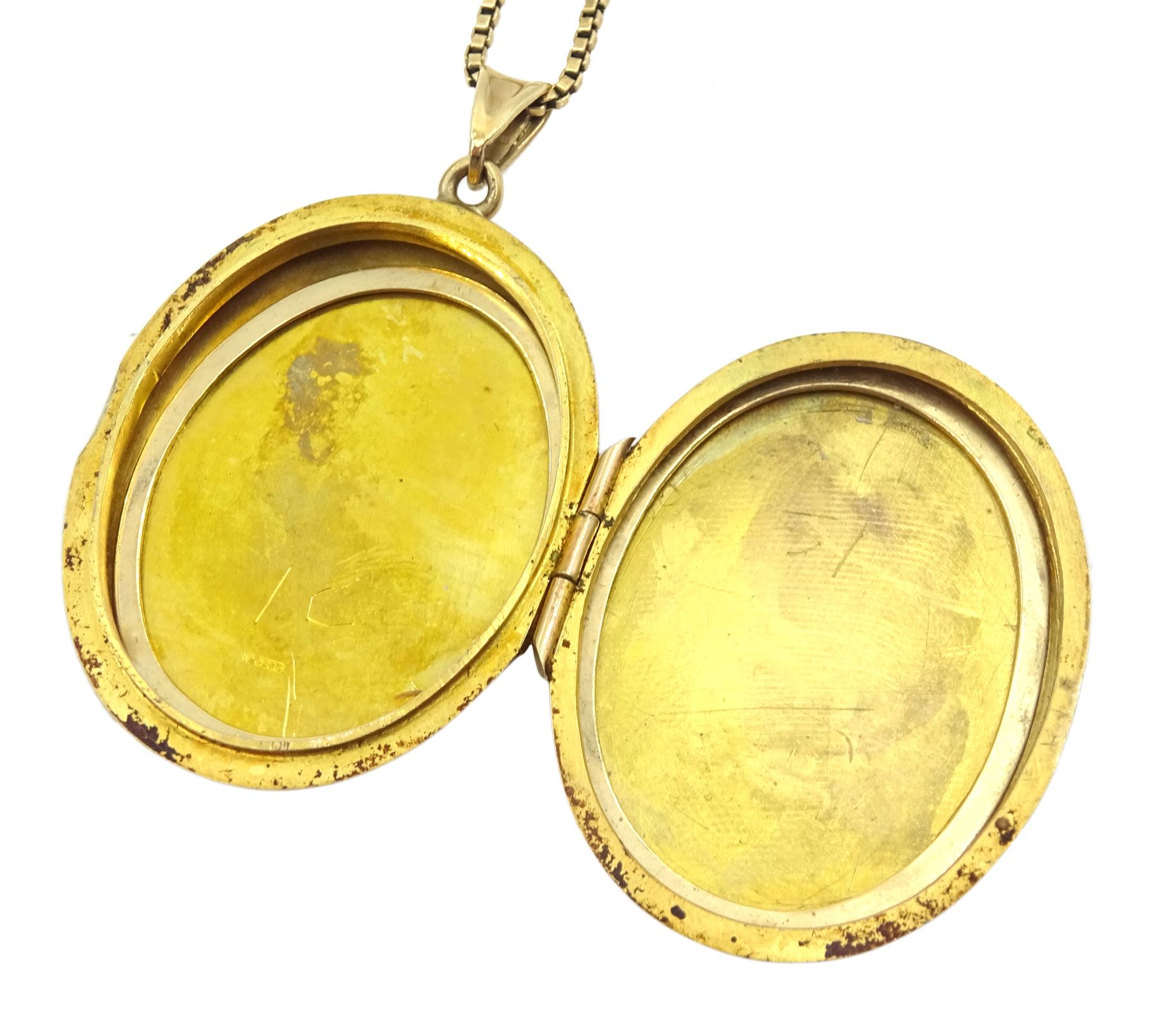 Gold locket pendant, with engraved rose decoration, on gold box link chain necklace, both 9ct