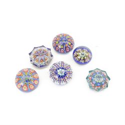 Six millefiori paperweights, two of eight pointed star form, four of domed form