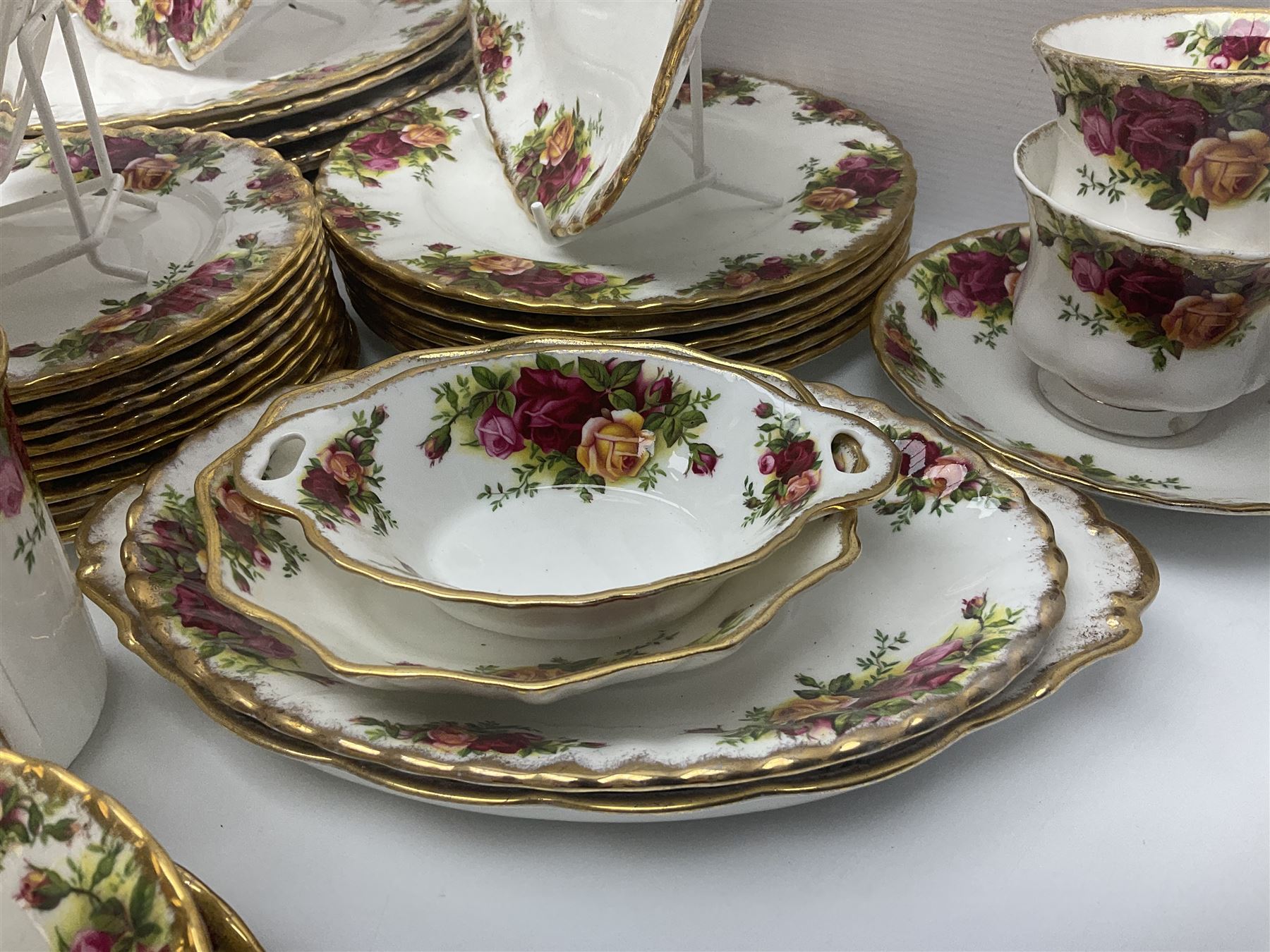 Royal Albert Old Country Roses pattern part tea and dinner service, to include two tureens, eight dinner plates, six side plates, twelve bowls, two mugs, seven teacups and saucers, milk jug,  twelve cake plates, six soup bowls and saucers, candlesticks, etc (95)