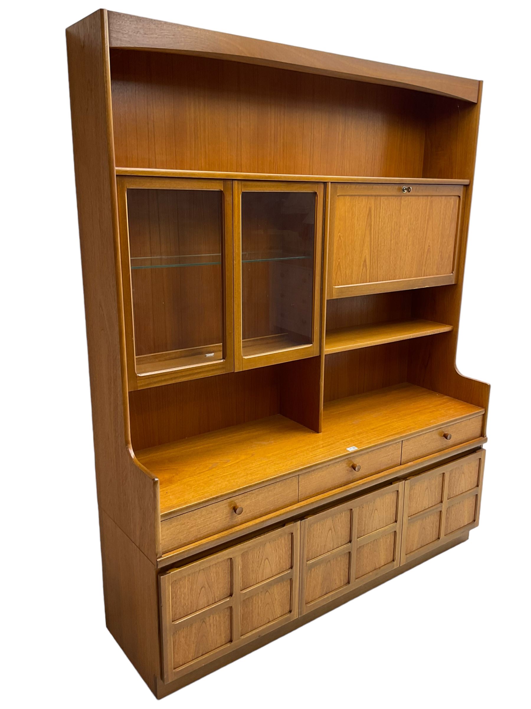 Nathan - teak wall unit, fitted with raised display cabinet and fall front compartment, three drawers and three cupboards below