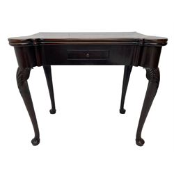 Late 18th century Irish mahogany tea table, rectangular form with projecting stepped rounded corners, fold-over action top over single frieze drawer within cock-beaded surround, on shell and bellflower carved cabriole supports, single gate-leg action base 