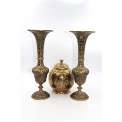 Pair of Cairo Ware vases, each of trumpet form, with foliate and black enamel decoration, together with a similar jar and cover, vases H33cm