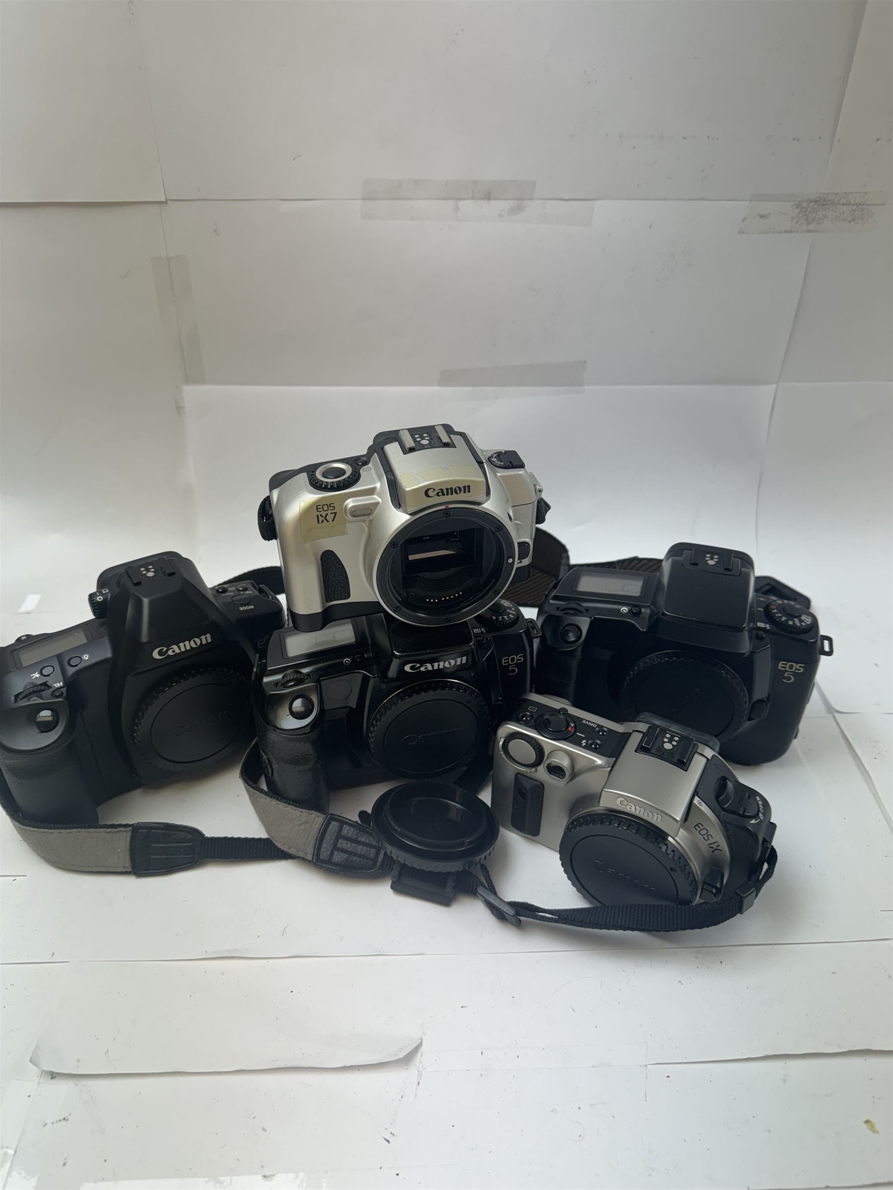 Five Canon EOS camera bodies, comprising EOS IX serial no. 0306280, EOS IX7 serial no. 1505354, EOS 3 serial no. 2743904, and two EOS 5 examples, serial nos. 1096604 & 9701653