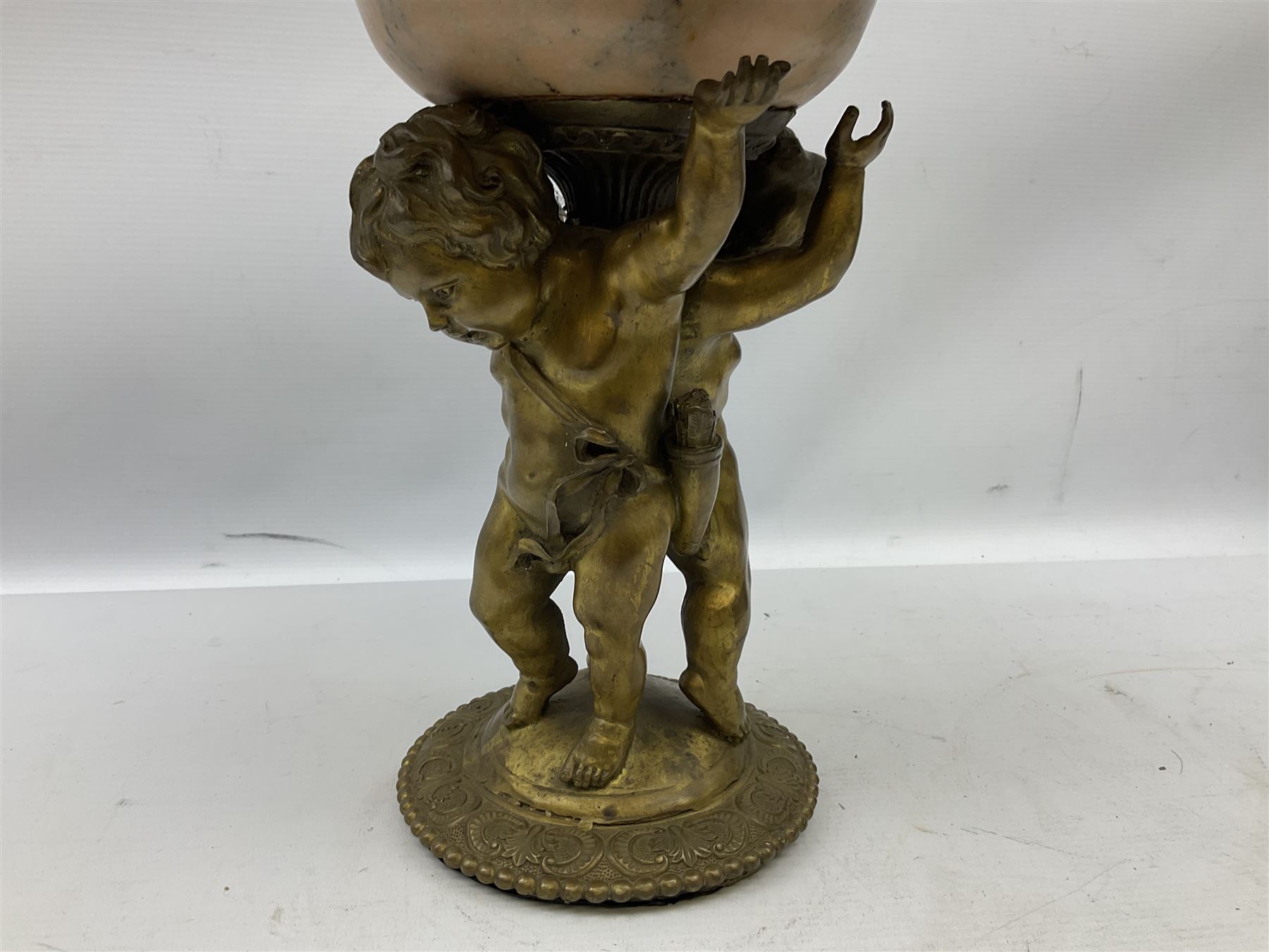 Brass centrepiece modelled as two cherubs supporting a marble bowl, stood upon a foliate design base, H32cm