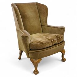 Early 20th century walnut framed wingback armchair, shallow wing back over wide seat with ...