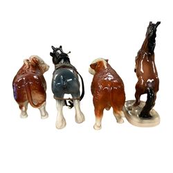 Two ceramic bulls, and two ceramic horses, tallest H27cm