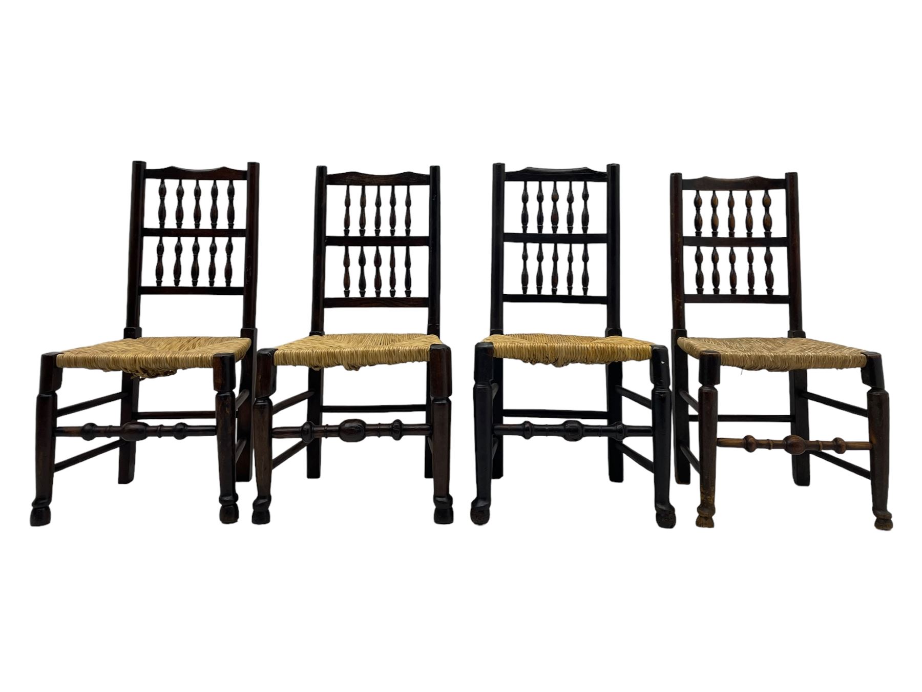 Matched set of twelve 19th century elm Lancashire spindleback dining chairs, shaped cresting rail over spindle back, rush seat, on turned supports united by turned stretchers, ring and globular turned front stretcher 