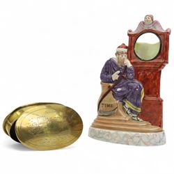 Victorian Staffordshire pocket watch stand, modelled as the Chronos, seated beside a grandfather clock, on oval marbled base, H23cm together with a 19th century oval brass snuff box engraved with Shrewsbury Castle, L13cm (2)