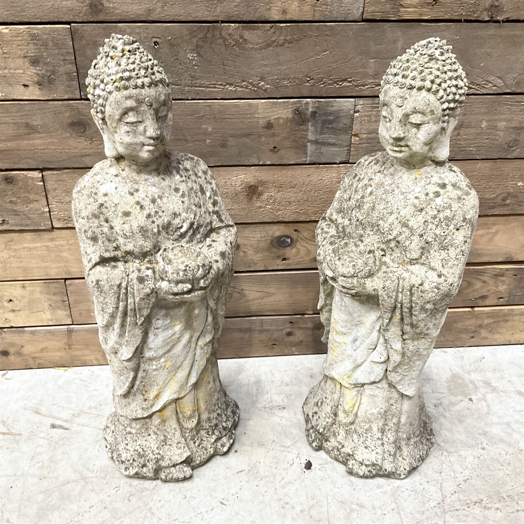 Pair of cast stone garden Buddahs