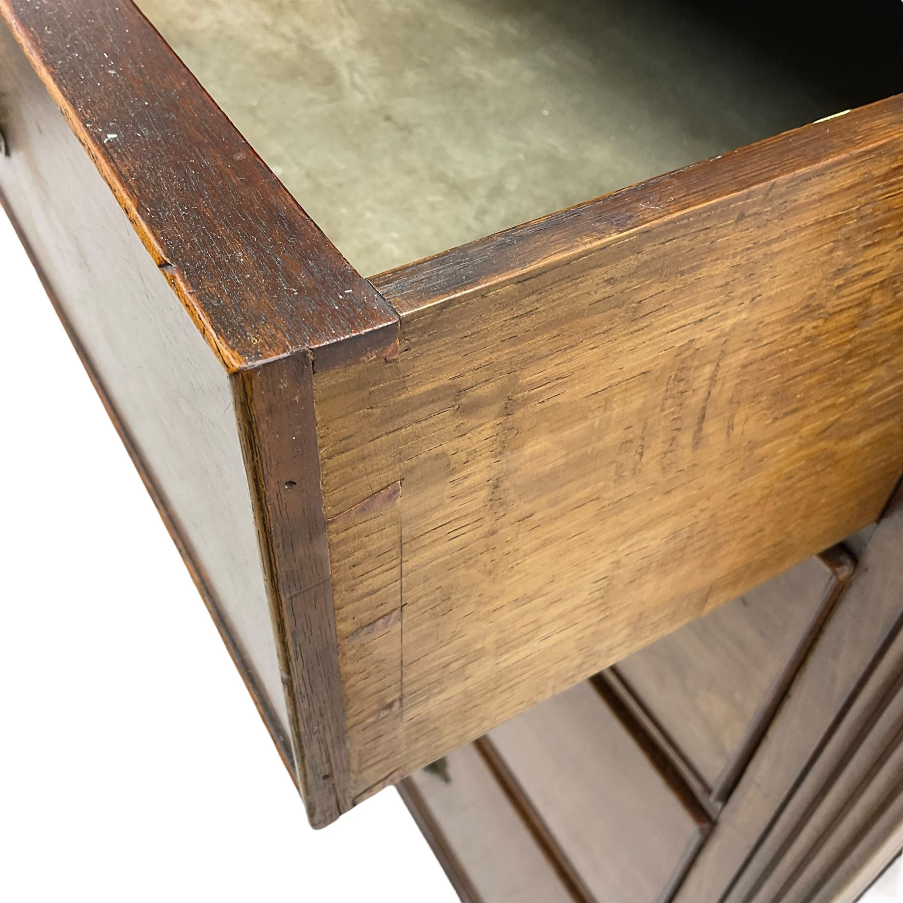 Early 19th century mahogany chest, three shallow frieze drawers over two short and three long cock-beaded drawers, canted corners with reeded moulded square columns, on ogee bracket feet