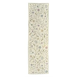 Kashmiri hand-stitched wool chain runner, featuring a cream ground decorated with meandering vines and an array of pastel flowers, enclosed by a plain light green border