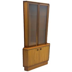 Nathan - teak corner display cabinet, double glazed doors enclosing two adjustable shelves over single cupboard.