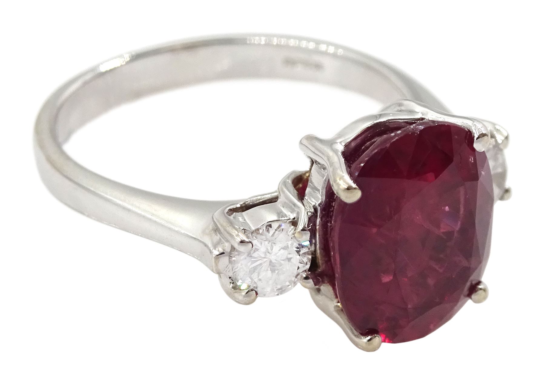 18ct white gold three stone oval cut ruby and round brilliant cut diamond ring, hallmarked, ruby approx 4.30 carat