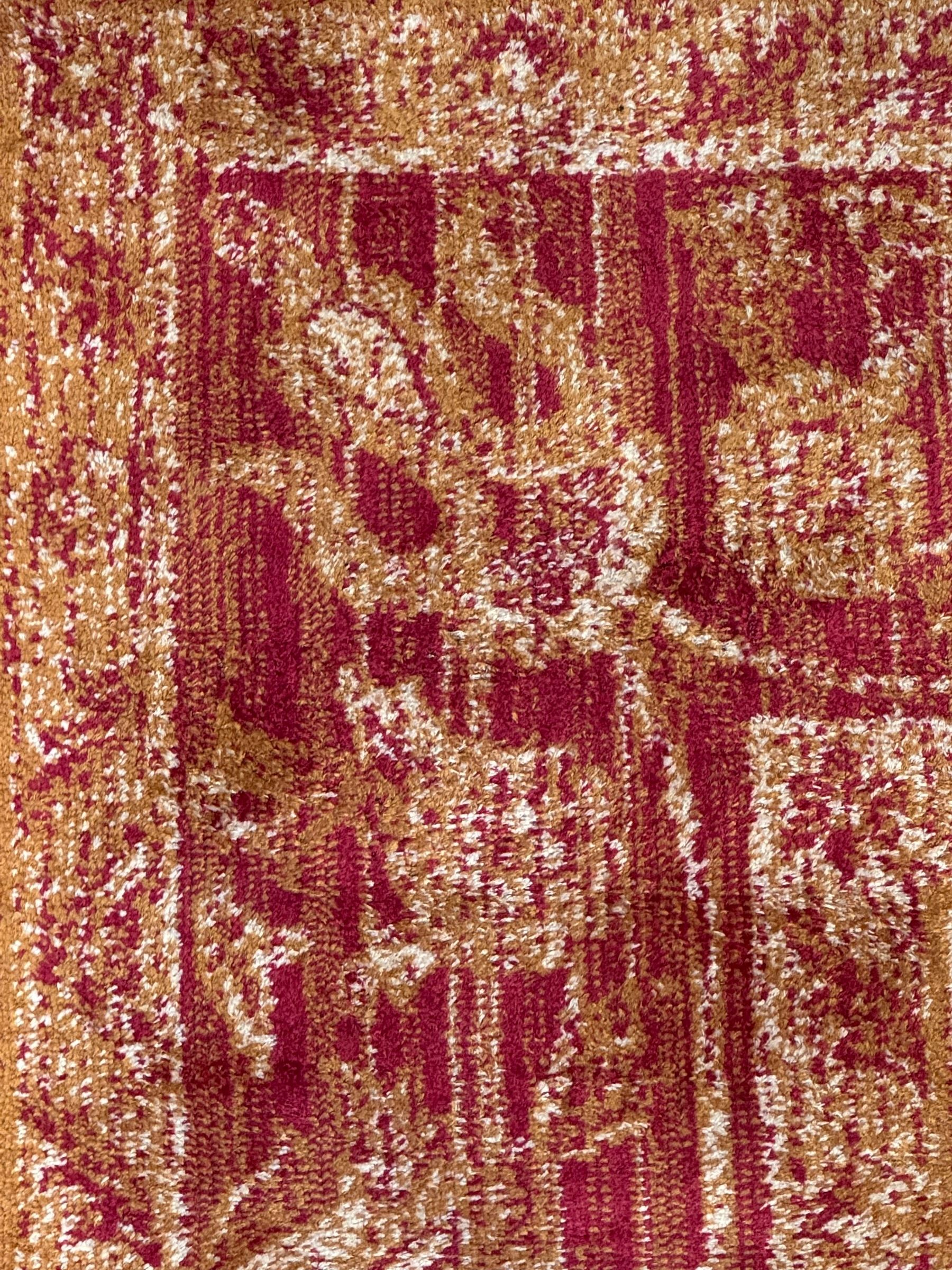 Persian Ziegler design amber ground rug, the field decorated with scrolling foliate decoration, enclosed by a border of repeating palmettes