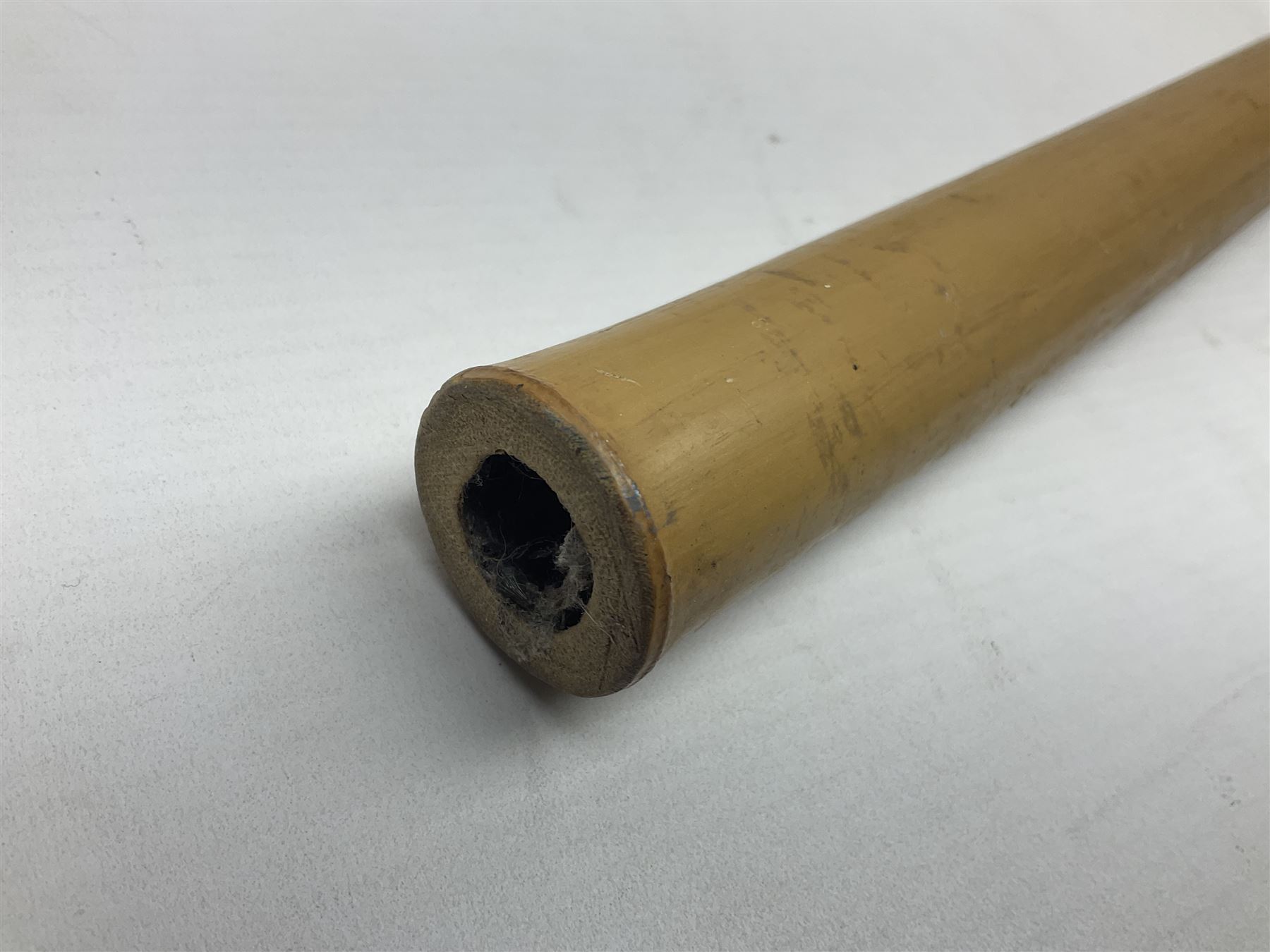 Bamboo cane torch, the pierced brass cover opening to reveal a wick, H144cm