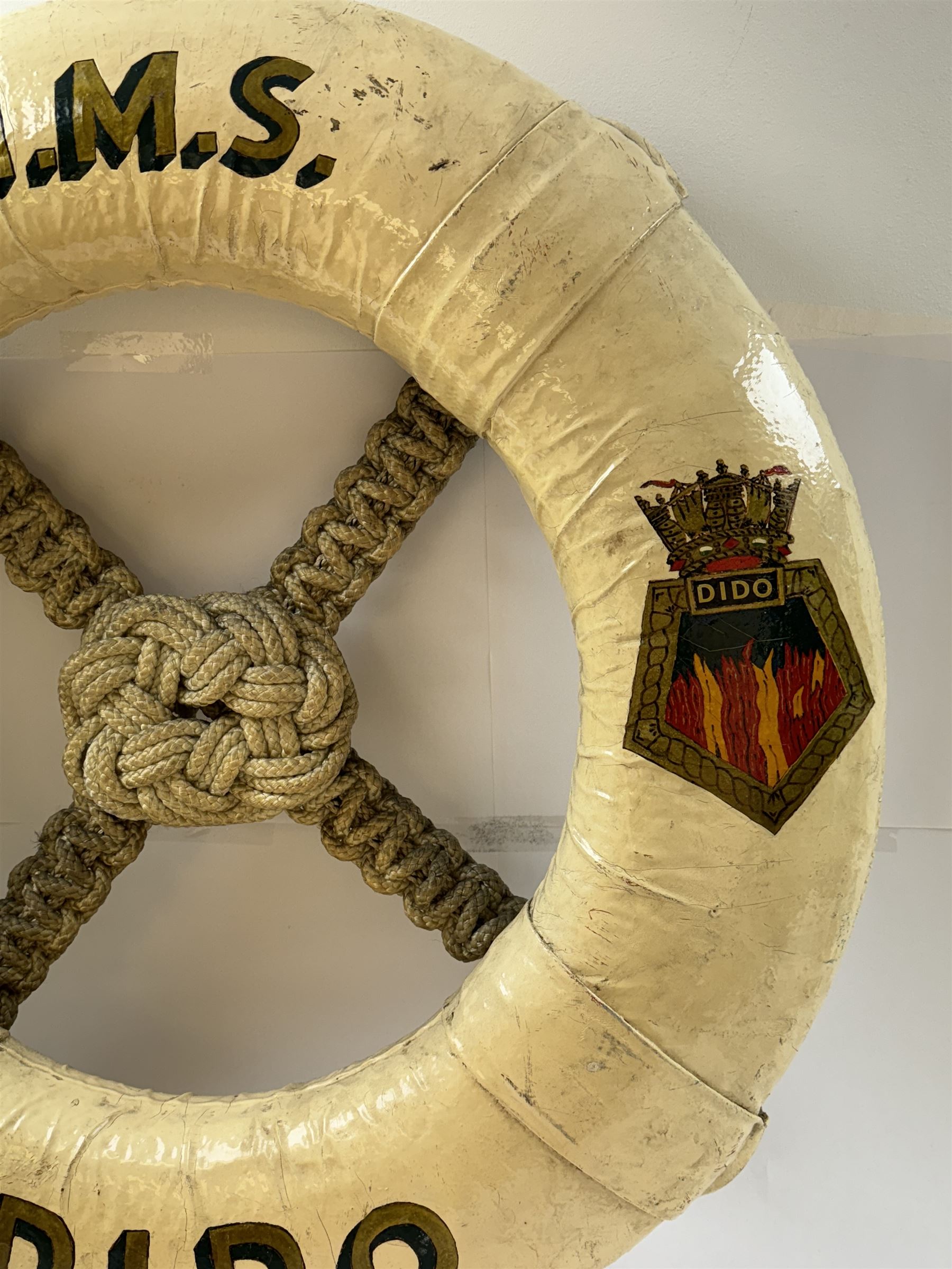 Late 19th/early 20th century ceremonial lifebuoy, from the Royal Navy light cruiser H.M.S Dido, the name painted in gilt lettering and with the ship's crest to either side, D74cm