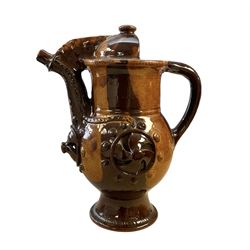 Treacle glaze pottery puzzle jug, H28cm