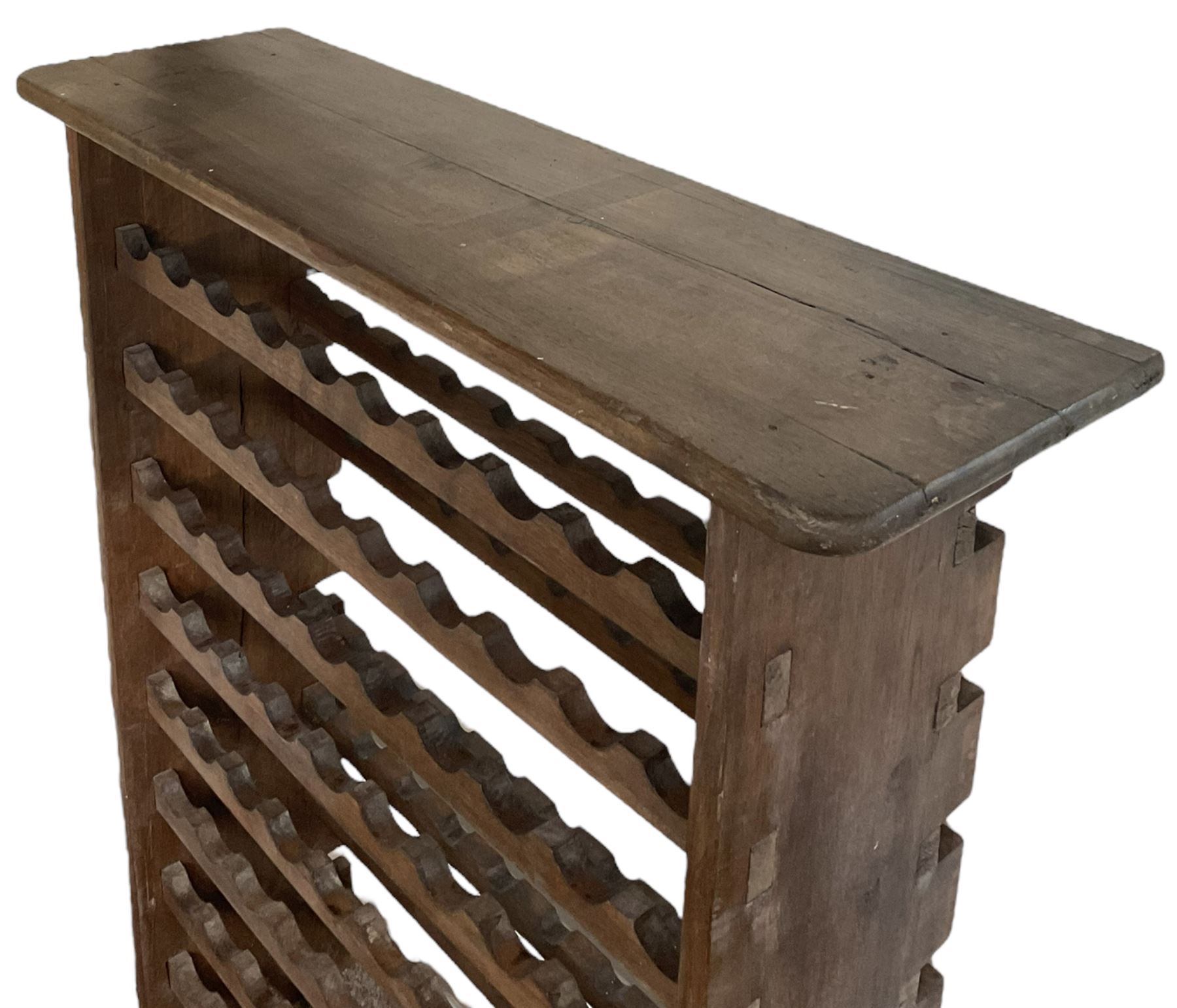 Large reclaimed oak eight tier wine rack, rectangular top over eight racks each with ten bottle divisions, on end supports