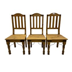 Set of six waxed pine dining chairs, shaped cresting over vertical slat back, plank seat on turned front supports 