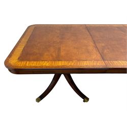 RBC Furniture (Made in England) - Georgian design mahogany dining table, rectangular top with rounded corners, satinwood and burr walnut bandings, two D-ends with two additional leaves and support rails, on barrel turned pedestals with four out-splayed reeded supports, brass cups and castors 