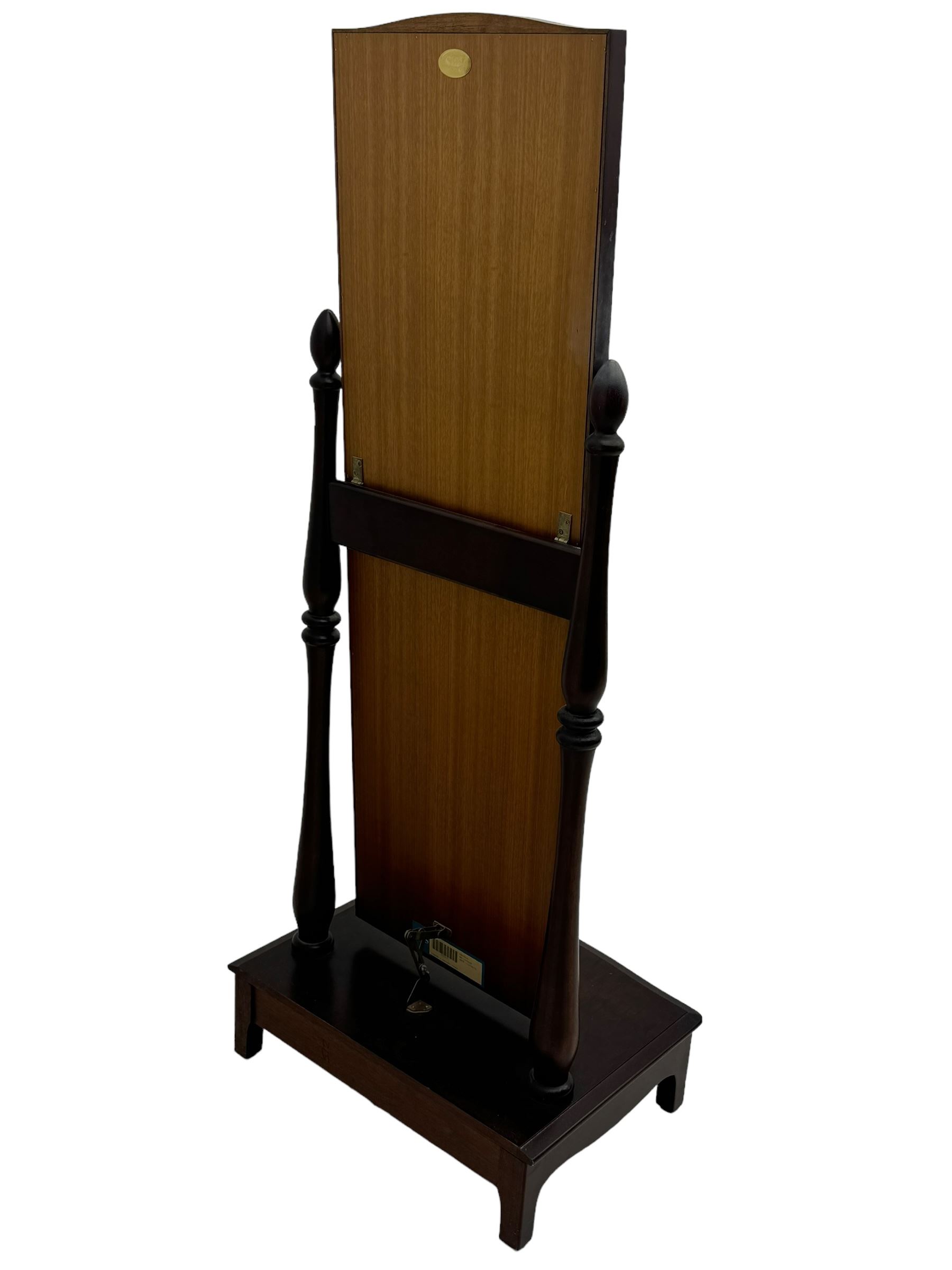 Stag Minstrel - mahogany cheval dressing mirror, arched top above full-length glass plate, supported by turned uprights with finials, on rectangular base with bracket feet 