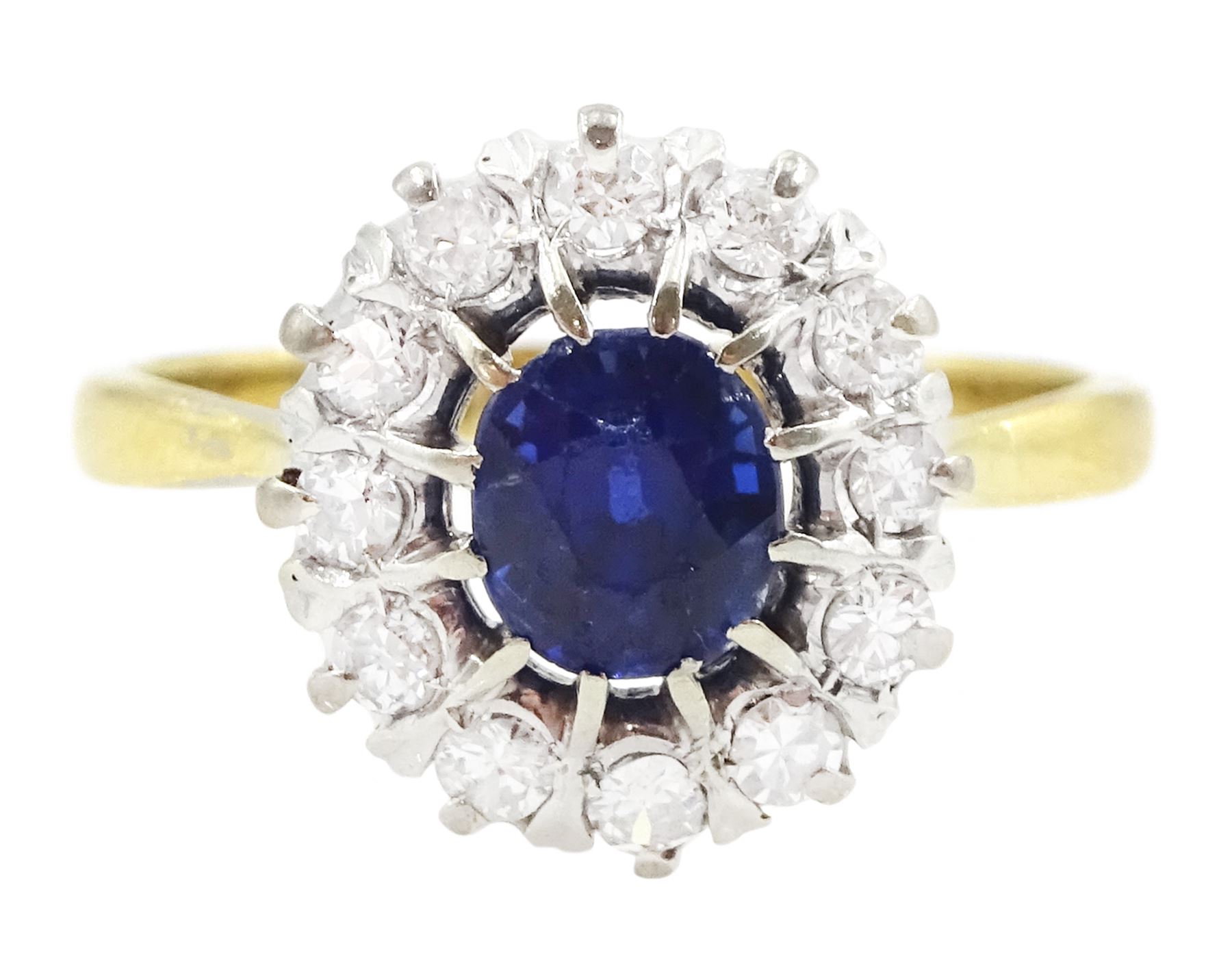 Gold oval cut sapphire and round brilliant cut diamond cluster ring, stamped 18ct Plat, sapphire approx 0.85 carat, total diamond weight approx 0.35 carat