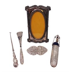 Group of silver, comprising Victorian spectacles case, with clip, hallmarked George Unite, Birmingham 1892, belt buckle with openwork decoration, silver handled button hook and shoe horn and a modern silver mounted photograph frame, all hallmarked, frame H19cm