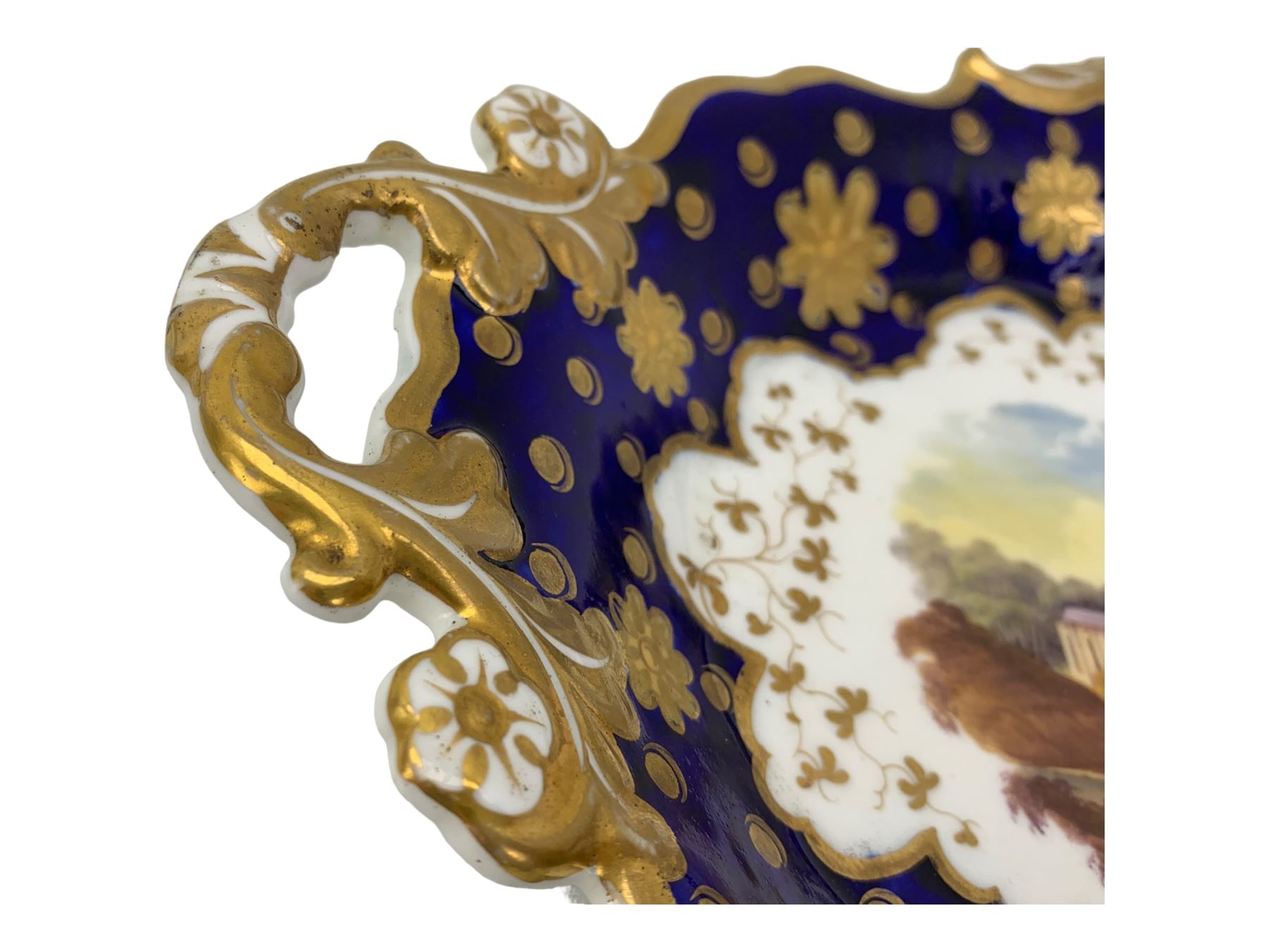 Early 19th century Ridgway twin handled oval dish, hand painted with figures in a river landscape, within a cobalt blue and moulded border, L30cm together with a similar twin handled serving dish, L28cm (2)