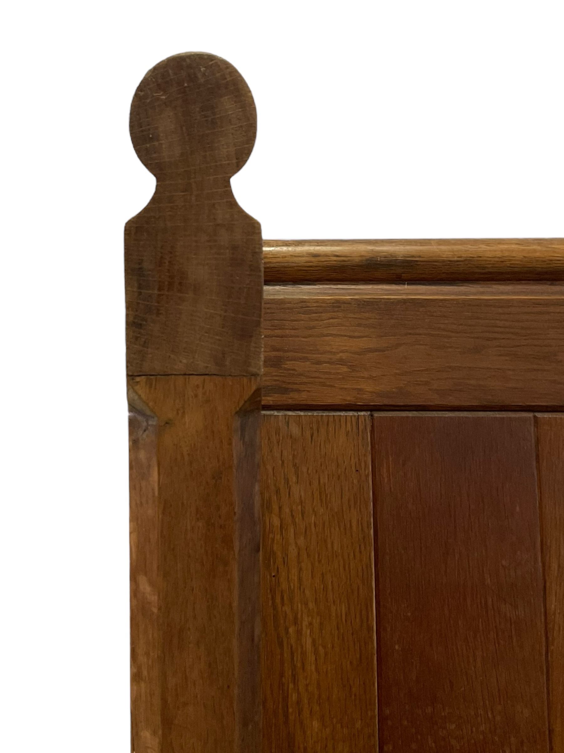 19th century oak church pew or hall bench, moulded cresting rail over panelled back and plank seat, on panelled end supports with chamfered frames